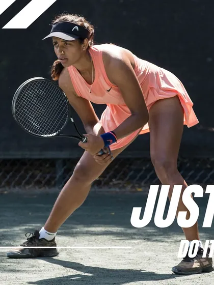Ready for anything. Tennis pro Riya Bhatia, focused and prepared on the court, embodying the "Just Do It" spirit.
