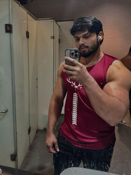 Another angle of a locker room selfie, showing the results of consistent training.