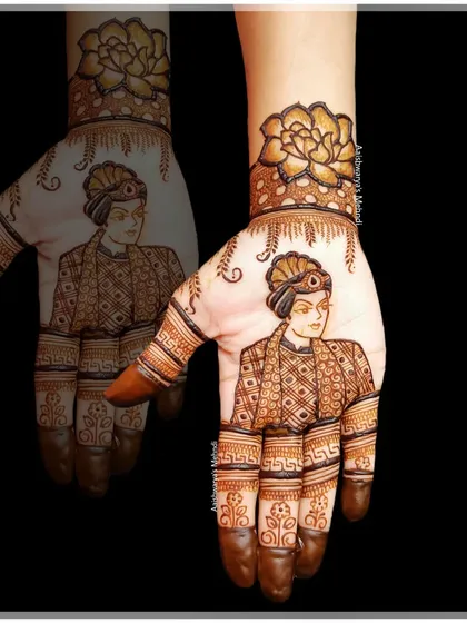 A detailed portrait of a groom on the palm, paired with a large floral motif on the wrist. This shows how we can create designs for the groom's side as well.