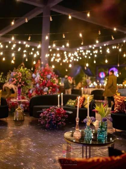 The lounge area was a mix of plush velvet sofas, vibrant cushions, and glowing lights. The entire space was designed to feel cozy and inviting, despite the grand, cosmic scale of the event.