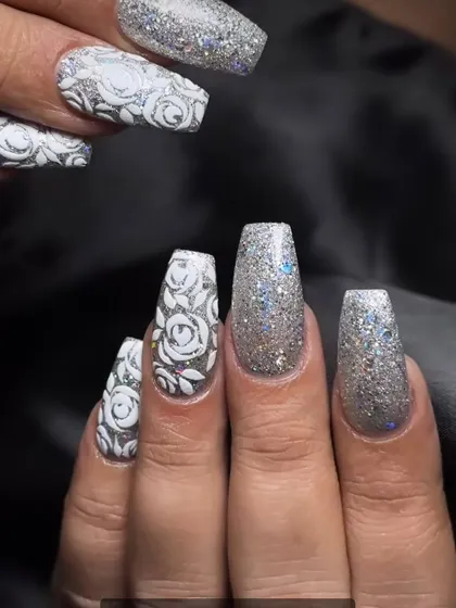 Another look at these incredible silver glitter coffin nails with detailed white rose patterns. The texture and sparkle are amazing.