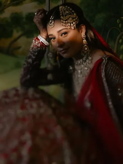 A quiet, painterly portrait of a bride, Angira, lost in thought before her ceremony. The soft lighting and rich background create a timeless, artistic feel that I love to explore in my bridal photography.