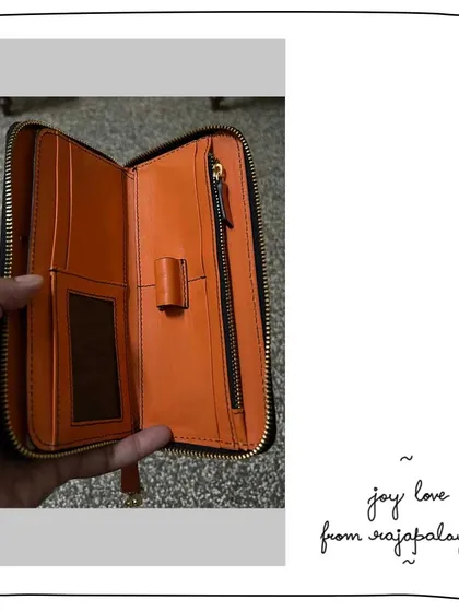The inside of the custom Moss and Carrot Joy wallet. This peek inside shows the functional layout with card slots, a zip compartment, and the beautiful contrast between the two leather colors.