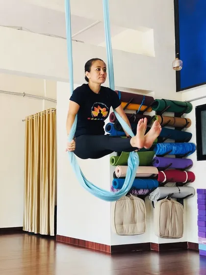 Aerial yoga isn't just about complex poses. Even simple seated positions in the hammock can help build core awareness and provide a moment of calm and focus during your practice.