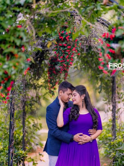 An intimate portrait of a couple under a floral archway, a perfect spot for a romantic and secluded photo.