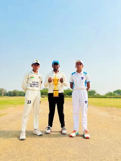 The captains and umpire with the trophy, ready for the big final.