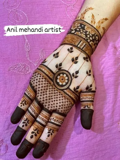 A very modern and chic back-of-hand design. The pattern uses clean lines, geometric grids, and delicate leaf motifs for a sophisticated look.