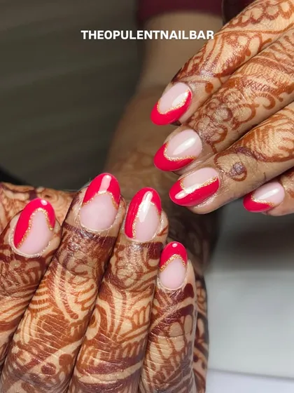 The perfect nails for an engagement. These modern French tips with a pop of red and a delicate gold line beautifully complement the henna.