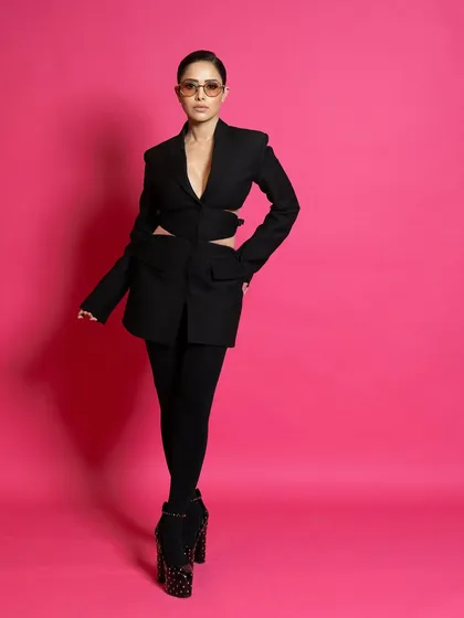 This full-length shot for ELLE uses a strong, centered pose to create a sense of power and symmetry.