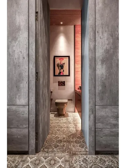 A view from the study into the attached washroom, showing how the carpet-like flooring continues seamlessly, connecting the two spaces.