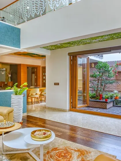 For 'A Home by the Park', we aimed to create a feeling of tropical luxury. The design opens up to a central courtyard with a water body, seamlessly connecting the living spaces and bringing the tranquility of nature right into the heart of the home.