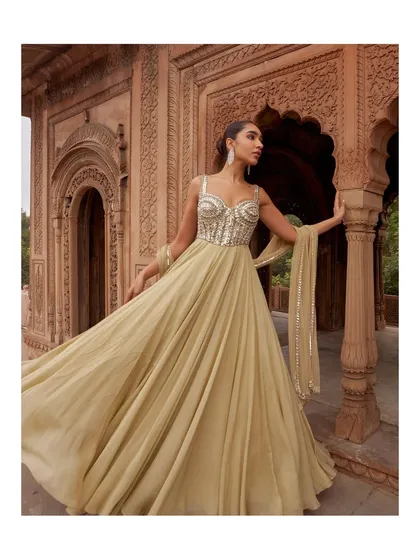 The movement of this gown is simply breathtaking. The lightweight, pleated fabric catches the light and air, creating a truly ethereal effect perfect for dancing.