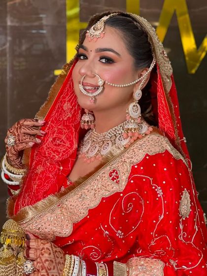 A happy and confident bride ready for her ceremony. The makeup is flawless, with a focus on bright eyes and a warm smile.