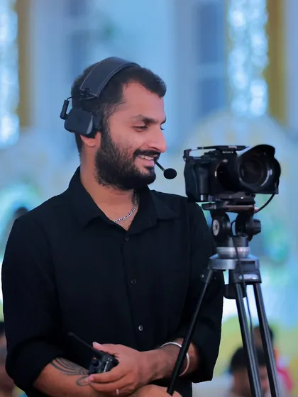 A candid shot of me at work, operating a camera with a headset on a professional set. This shows my experience and focus as a Director of Photography during a shoot.