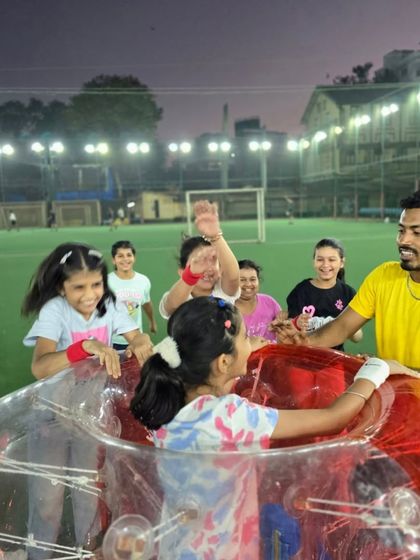 Kids eagerly await their turn in the Zorb ball. Our coaches ensure everyone gets a chance to participate in this incredibly fun and popular activity.
