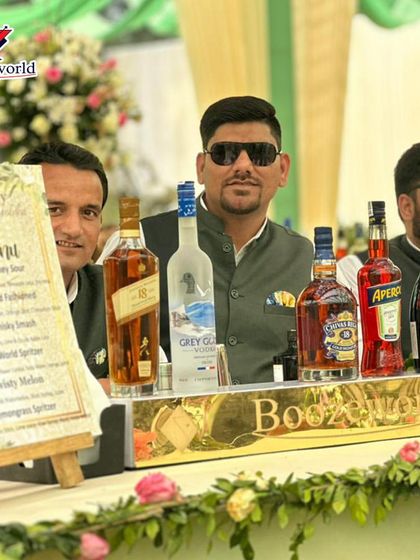 Our team, dressed for a sophisticated wedding, stands proudly behind a fully stocked bar. We ensure our staff's appearance and professionalism match the elegance of your event.