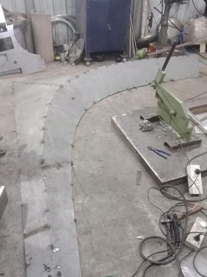 In the workshop, the metal formwork for the curved balcony mould is being fabricated. This is where our digital design is translated into a physical tool for construction.
