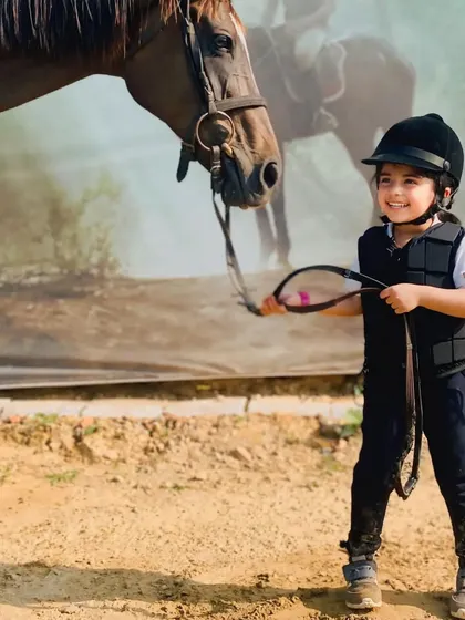 This young rider is ready to go. We provide all the necessary safety gear, including helmets and protective vests, for every session.