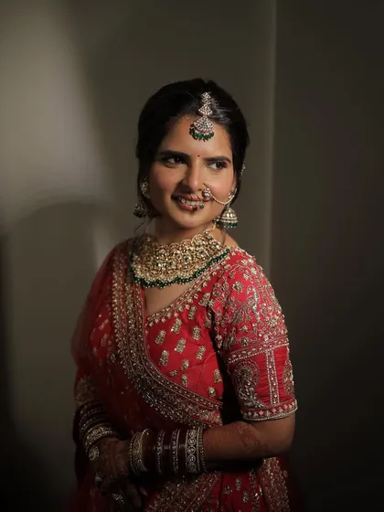 The play of light and shadow highlights the flawless base and soft contouring. This look was all about creating a radiant glow that felt natural and true to the bride's personal style.