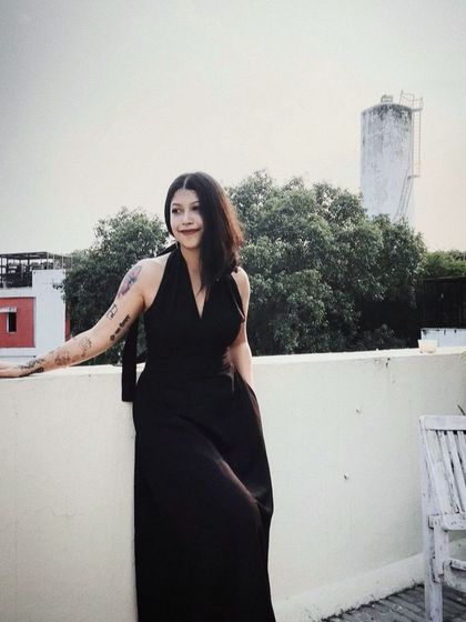 A self-portrait on my rooftop in a classic black dress from Doodlage. It’s about feeling good in what you wear, even in your own space.