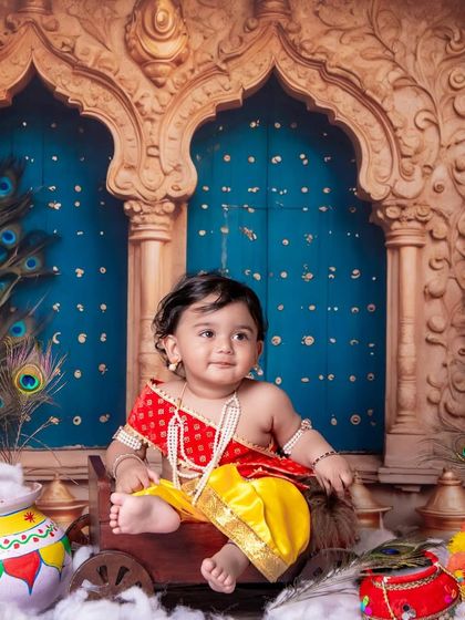 Little heart, infinite love, blessed by Lord Krishna’s grace. The details in the backdrop add so much richness.