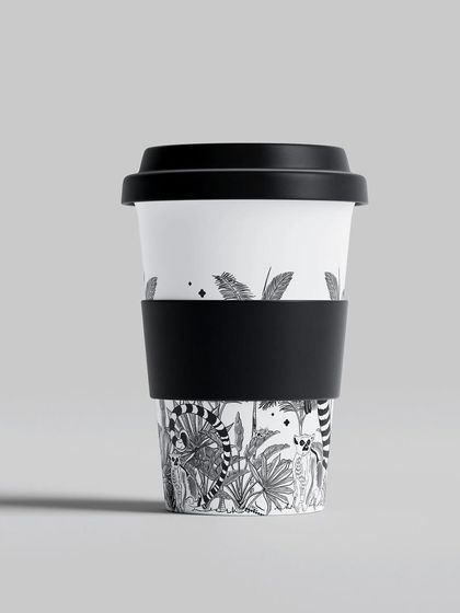 My 'Treasures of Madagascar' pattern on a reusable coffee cup. I love seeing my detailed line work on everyday objects, bringing a bit of wild beauty to your daily routine.