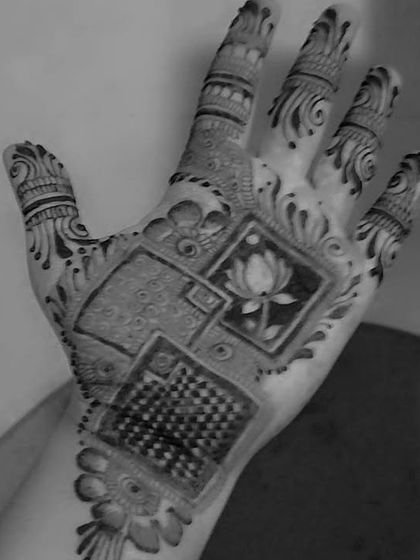 A modern take on personalization, this design features a beautiful lotus flower inside a geometric frame. The lotus symbolizes purity and beauty.