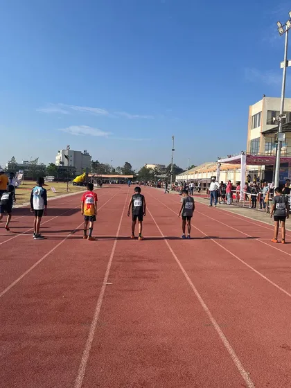 Athletes line up on the track, ready to give their all on the final day of the meet.