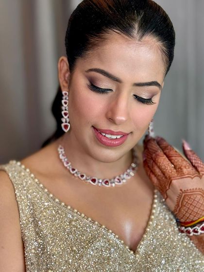 A close-up of Priyanka's beautiful smile and her soft glam makeup for her post-wedding event.