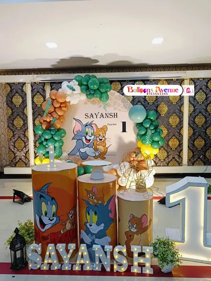 The complete Tom and Jerry first birthday setup with all props and decorations in place.