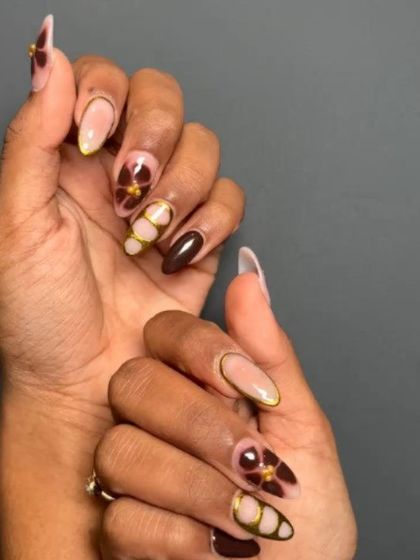 A rich and earthy design featuring a deep brown base with hand-painted abstract florals and gold accents.