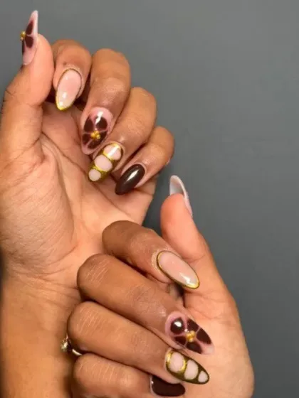 A rich and earthy design featuring a deep brown base with hand-painted abstract florals and gold accents.