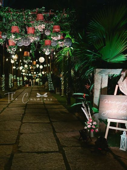 This shot captures the moody and romantic ambiance of the reception entrance, promising a night of elegance and celebration.