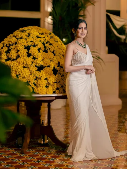 Elegance is an attitude. Modeling this beautiful white saree at the Radisson Blu in Goa, I aimed to create a look of timeless grace. This is the sophisticated and poised style I bring to shoots for high-end sarees and evening wear.