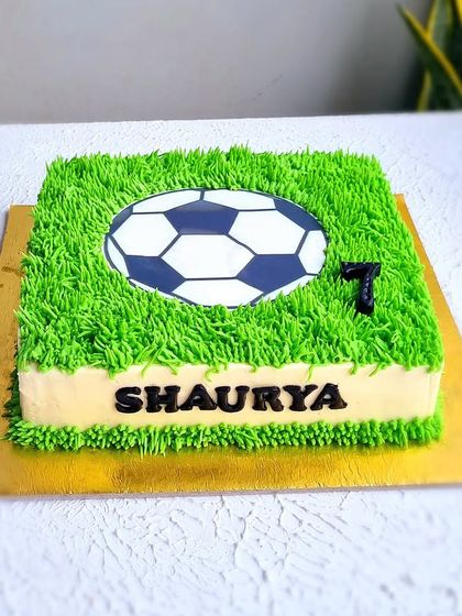 A square football cake with a buttercream grass effect. This is a great example of how to create texture using just a piping tip.