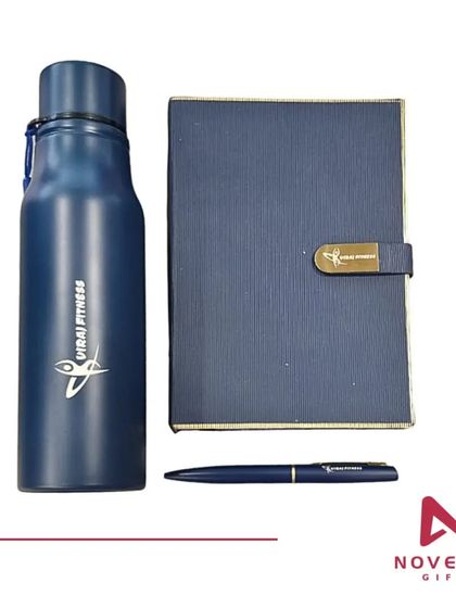 The contents of the Global Fitness welcome kit laid out. The cohesive branding on the bottle, diary, and pen creates a professional and welcoming gift.