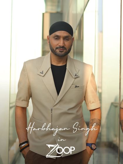 Harbhajan Singh in a custom short-sleeved beige blazer. The unique epaulet details and tailored fit demonstrate our flair for creating one-of-a-kind pieces.