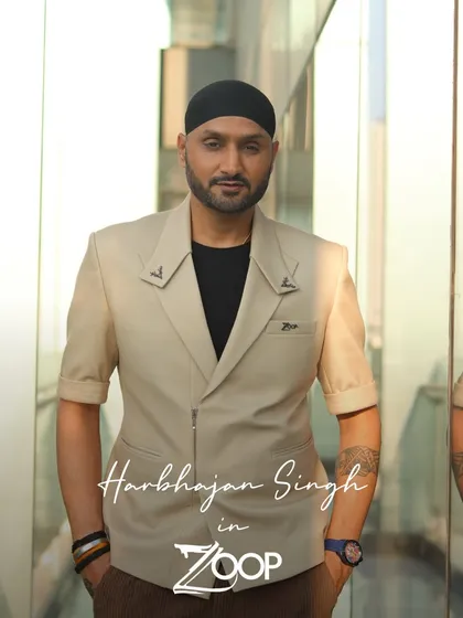 Harbhajan Singh in a custom short-sleeved beige blazer. The unique epaulet details and tailored fit demonstrate our flair for creating one-of-a-kind pieces.