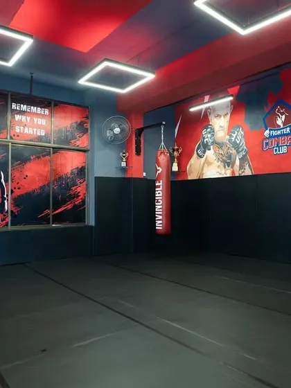 A wide view of our training floor, with the cage in the background and murals of MMA legends on the wall to inspire you. This is where you will grind.