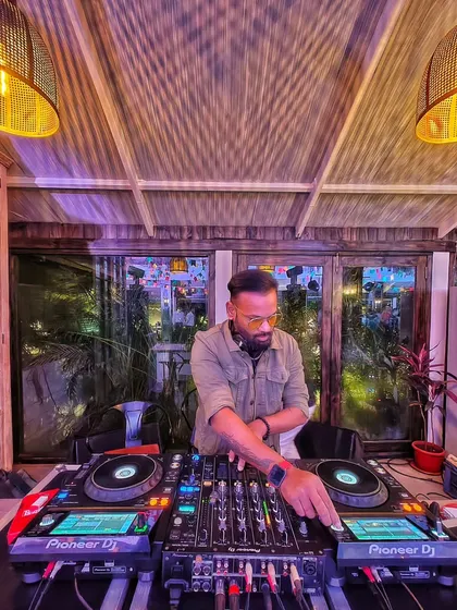 At the console, focused on the music. My dream is to make you dance every single night.