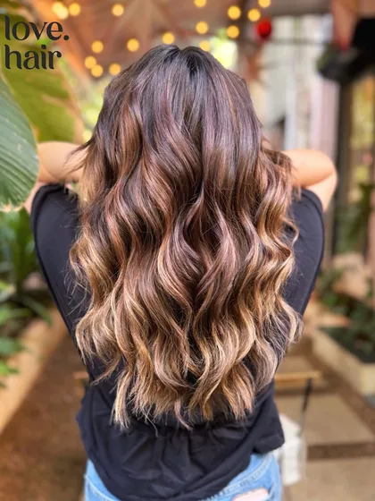 The perfect sun-kissed look. This brown balayage gives that natural, effortless glow, like you just got back from a beach vacation. (No filter)
