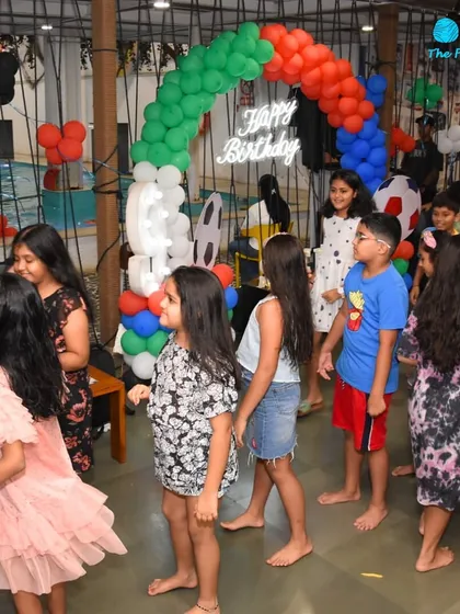The cafe area set up for a birthday bash right by the pool. Guests can move easily between the party space and the water, creating a seamless and interactive event experience.