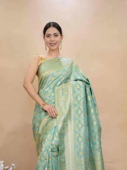 This light turquoise Banarasi silk saree is another example of a traditional weave made easy. As a 1-minute saree, it offers a grand look with the simplicity of a wrap-around skirt.