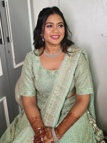 A candid shot showing the beautiful, dewy finish of the makeup. This look is perfect for clients who want to look glamorous yet natural.