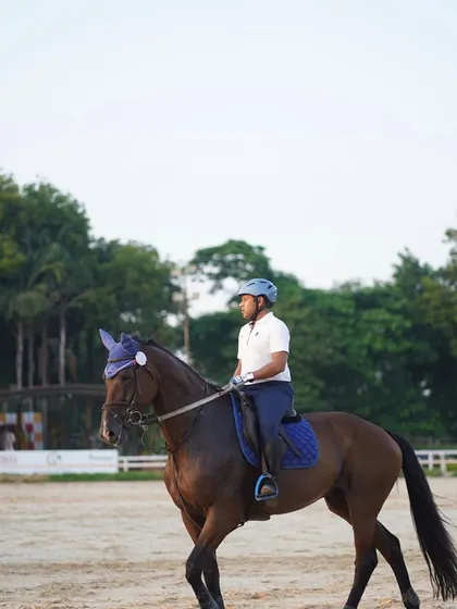 A rider and his horse, Coffee, demonstrating our core belief: they are sport partners, not sport equipment. This philosophy of respect and trust is central to everything we do.