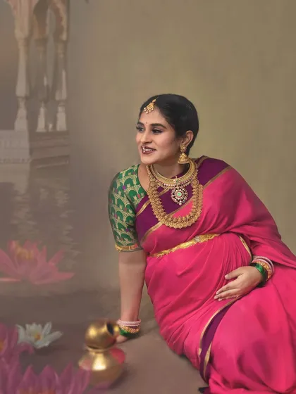 A serene moment by the painted lotus pond, this portrait has a calm, reflective quality. The mother-to-be's gentle smile and the soft colors create a beautiful, artistic memory.