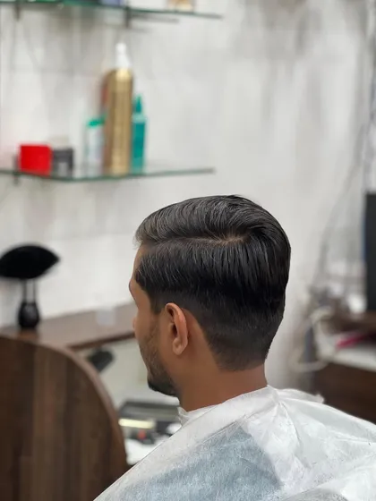 The back view of a perfectly executed taper fade, showing the clean lines and smooth gradient that define a quality men's haircut.