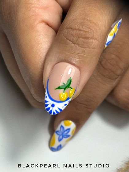 A close-up of the Moroccan-inspired nail art, showing the detailed lemon and tile patterns. This demonstrates my ability to create complex, multi-faceted designs that tell a story.