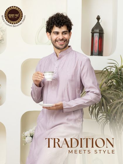Tradition meets style. A model enjoys a cup of tea in a comfortable and stylish mauve-colored kurta, showing that ethnic wear can be perfect for relaxed, everyday moments too.