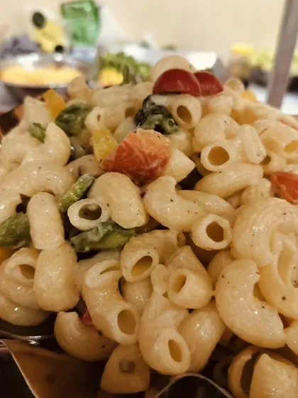 A close-up of my vegetable macaroni salad, a crowd-pleasing dish that is perfect for events with guests of all ages.